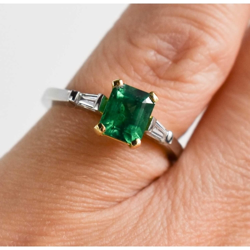 227 - A platinum and 18ct mounted emerald and diamond ring, size K, 4.3g.