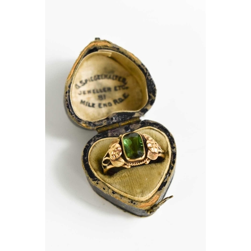 28 - A 19th century 9ct rose gold and green garnet ring, the rectangular cushion cut stone set with a rop... 