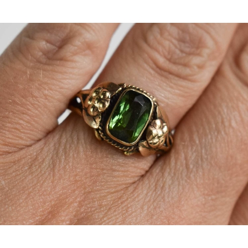 28 - A 19th century 9ct rose gold and green garnet ring, the rectangular cushion cut stone set with a rop... 