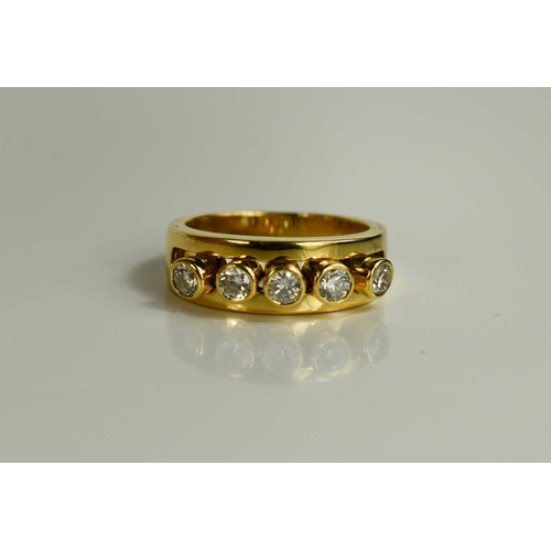 294 - A 18ct gold and diamond five stone ring, the five brilliant cut diamond collets are movable within a... 