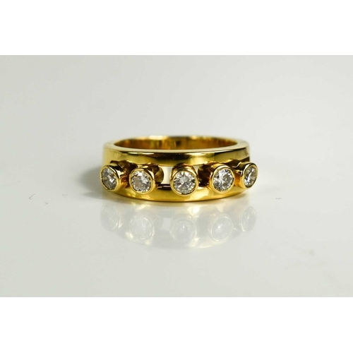 294 - A 18ct gold and diamond five stone ring, the five brilliant cut diamond collets are movable within a... 