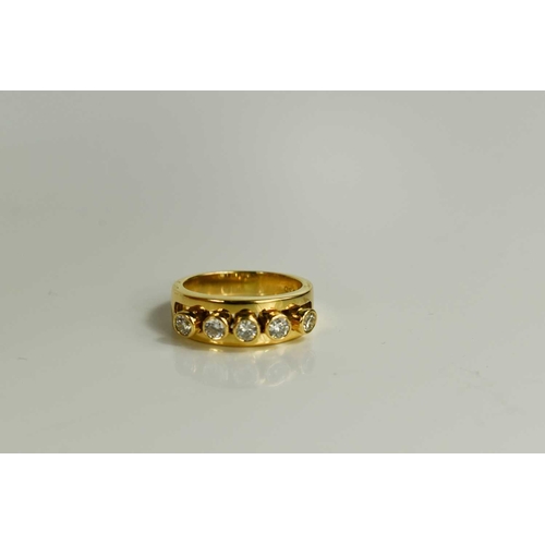 294 - A 18ct gold and diamond five stone ring, the five brilliant cut diamond collets are movable within a... 