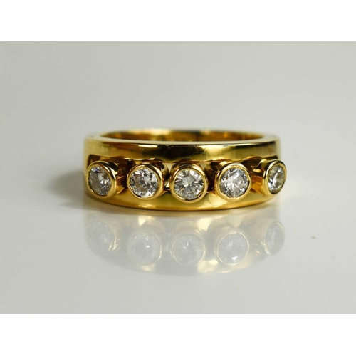 294 - A 18ct gold and diamond five stone ring, the five brilliant cut diamond collets are movable within a... 