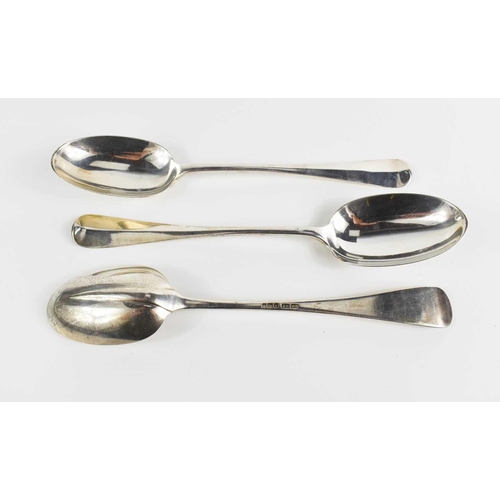 307 - A set of three Edwardian silver serving spoons in the Hanovarian rat tail pattern, Joseph Rodgers & ... 