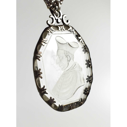 33 - A 19th century silver and intaglio, likely rock crystal pendant necklace, depicting a Cardinal, 8 by... 