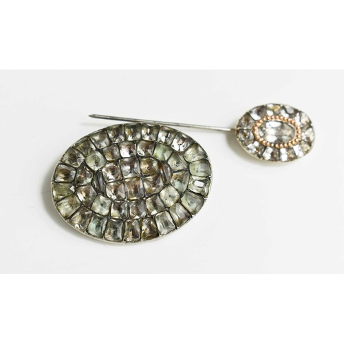 35 - A Georgian silver and gemset oval brooch, 4cm wide, in white and pale green hues, together with a si... 