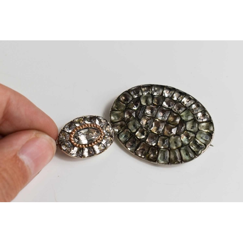 35 - A Georgian silver and gemset oval brooch, 4cm wide, in white and pale green hues, together with a si... 