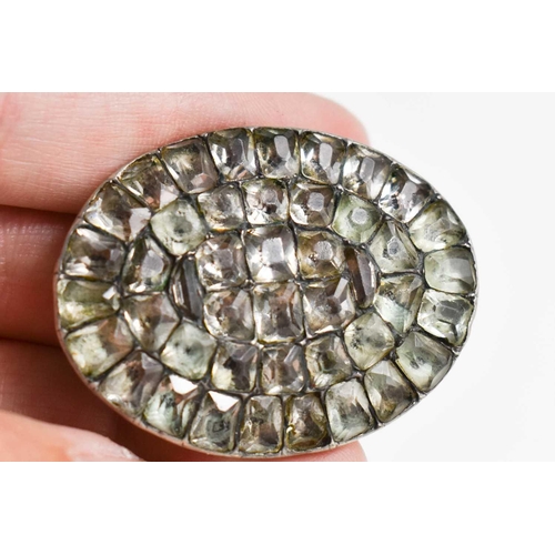 35 - A Georgian silver and gemset oval brooch, 4cm wide, in white and pale green hues, together with a si... 