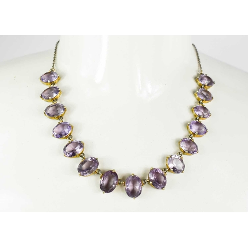 47 - A Georgian gilt metal and amethyst necklace, composed of oval cut amethysts, 20.90g.