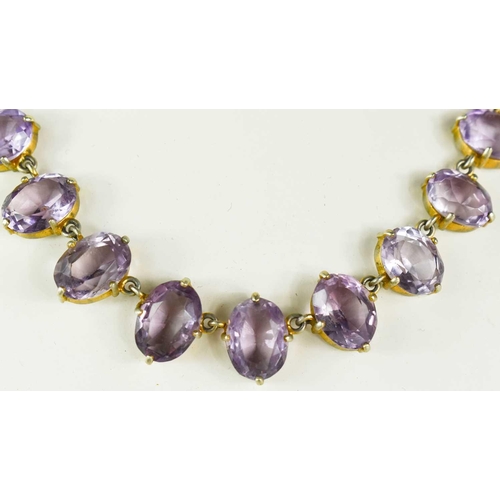 47 - A Georgian gilt metal and amethyst necklace, composed of oval cut amethysts, 20.90g.