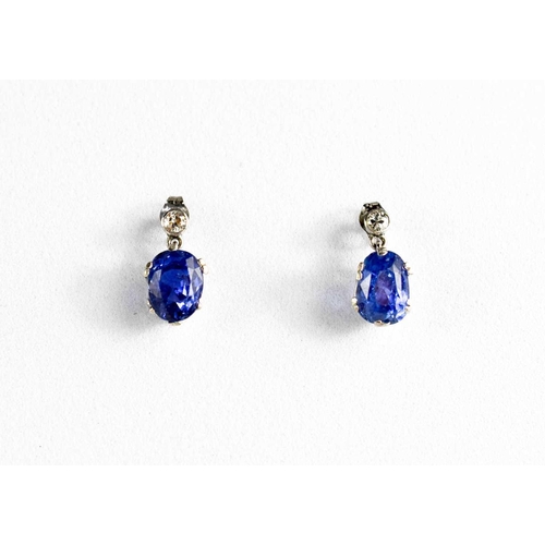 49 - A pair of white gold, blue sapphire and diamond stud earrings, 2.69g.