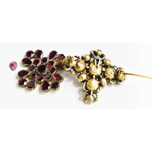 50 - A Georgian gilt metal, garnet and natural pearl set brooch, and a Victorian garnet set brooch A/F.