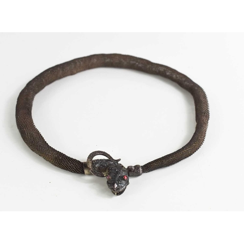 53 - A silver 19th century chain metal 'expandable' necklace, with a snake head clasp inset with small ru... 