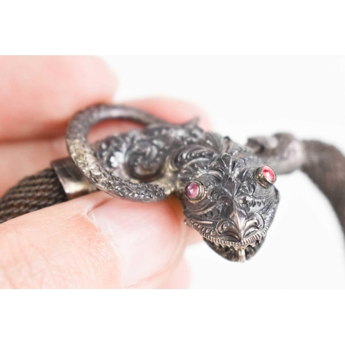 53 - A silver 19th century chain metal 'expandable' necklace, with a snake head clasp inset with small ru... 