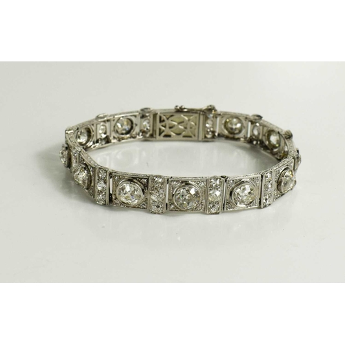 65 - An exceptional Art Deco period platinum and diamond bracelet, each of the eleven primary links set w... 