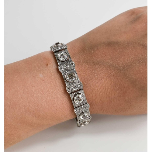 65 - An exceptional Art Deco period platinum and diamond bracelet, each of the eleven primary links set w... 