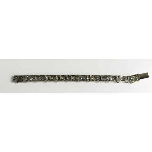 65 - An exceptional Art Deco period platinum and diamond bracelet, each of the eleven primary links set w... 