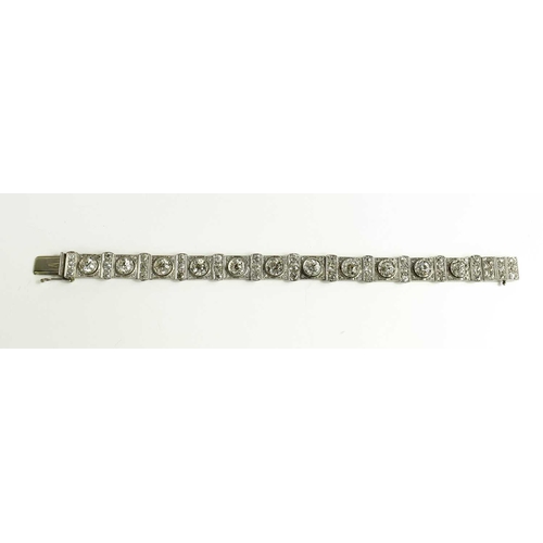 65 - An exceptional Art Deco period platinum and diamond bracelet, each of the eleven primary links set w... 