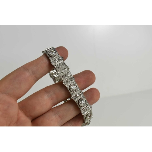 65 - An exceptional Art Deco period platinum and diamond bracelet, each of the eleven primary links set w... 