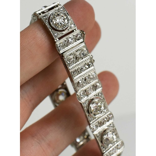 65 - An exceptional Art Deco period platinum and diamond bracelet, each of the eleven primary links set w... 