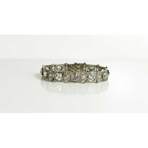 65 - An exceptional Art Deco period platinum and diamond bracelet, each of the eleven primary links set w... 