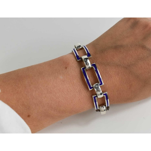 84 - A silver and enamel bracelet, composed of curved rectangular cobalt blue enamel set links, 1.02toz.