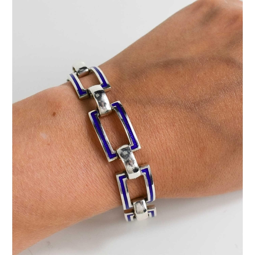 84 - A silver and enamel bracelet, composed of curved rectangular cobalt blue enamel set links, 1.02toz.