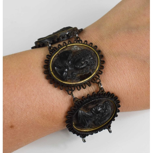 87 - Two Victorian profile portrait bracelets, one composed of five relief moulded portraits on oval silv... 