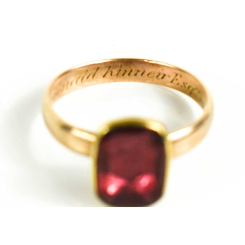 9 - A Georgian gold [tested as] and foil backed pink paste ring, inscribed John Mcdonald Kinnier Esq of ... 