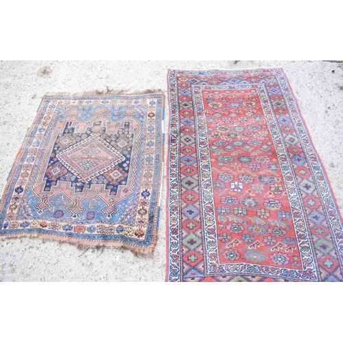 509 - Two small Persian rugs, larger one 106cms by 185cms