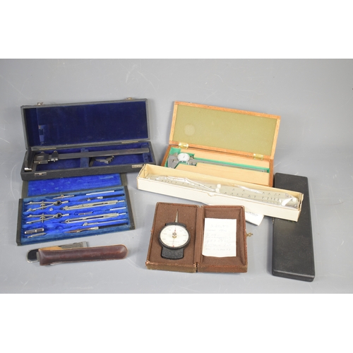 303 - A group of engineering and drafting tools to include a vernier calliper inside a velvet lined case, ... 