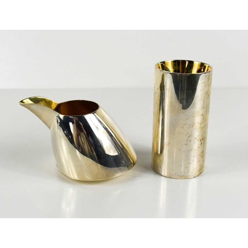 111 - Barry Thomas, a silver milk jug and a silver salt, with gilded interiors, London 2006, 11.67toz. [Th... 