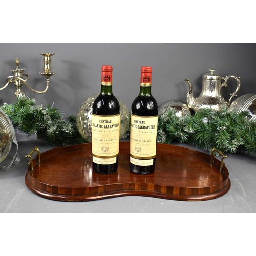 52 - Two bottles of Chateau Malartic-Lagraviere red wine, Grand Vin de Bordeaux, 1975, shipped for Christ... 