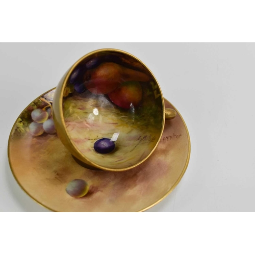 103 - A Royal Worcester miniature cup and saucer, painted with fruit to a mossy ground, the saucer signed ... 