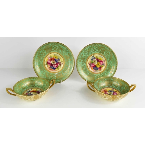 119 - A pair of Royal Worcester bowls and stands, painted to the centres with floral sprays by Phillips wi... 