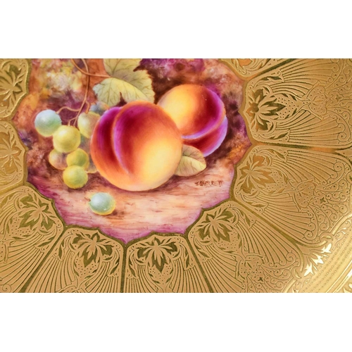 134 - A Royal Worcester bowl by Skerrett, painted to the centre with peaches and grapes, on a mossy ground... 