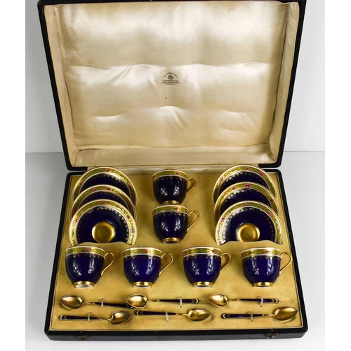 149 - A set of Royal Worcester coffee cups and saucers, with gilded enamel spoons by Mappin & Webb, cobalt... 