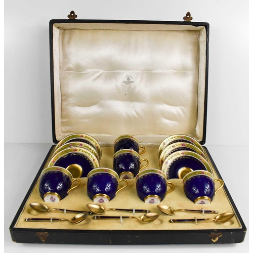 149 - A set of Royal Worcester coffee cups and saucers, with gilded enamel spoons by Mappin & Webb, cobalt... 