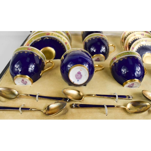 149 - A set of Royal Worcester coffee cups and saucers, with gilded enamel spoons by Mappin & Webb, cobalt... 