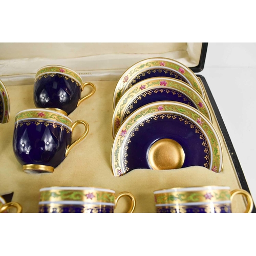 149 - A set of Royal Worcester coffee cups and saucers, with gilded enamel spoons by Mappin & Webb, cobalt... 