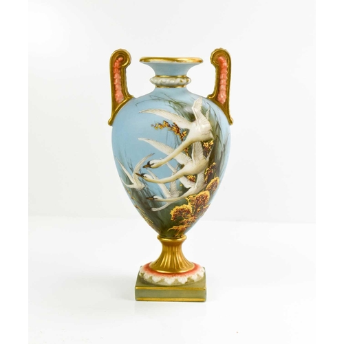 151 - A Fine Royal Worcester twin handled vase, by Baldwyn, painted with four swans in flight, and a swall... 