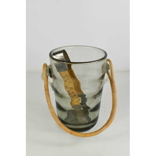 17 - A Holmgaard smoky glass mid century ice bucket, with rattan handle and matching brushed steel pair o... 