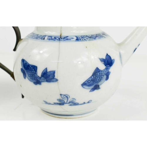 185 - An 18th century Chinese, Qianglong, blue and white teapot, with metal handle, and another later exam... 