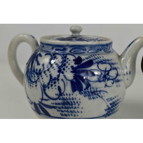 185 - An 18th century Chinese, Qianglong, blue and white teapot, with metal handle, and another later exam... 