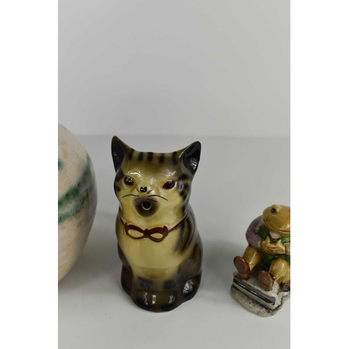 204 - A Tony Wood cream jug in the form of a cat, with mouth as spout, a Beswick Mr Fisher, and a Studio P... 