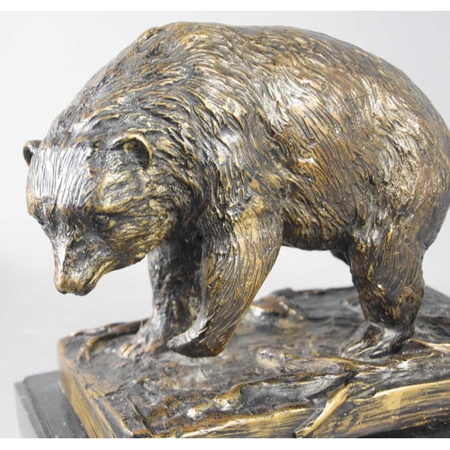 239 - I. Prince (20th century): bronze sculpture of a bear on naturalistic base, and raised on a black sla... 