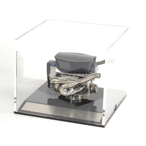 244 - Formula 1 memorabilia: A detailed scale model of the 2008 Mercedes-Benz FO108V V8 engine set within ... 