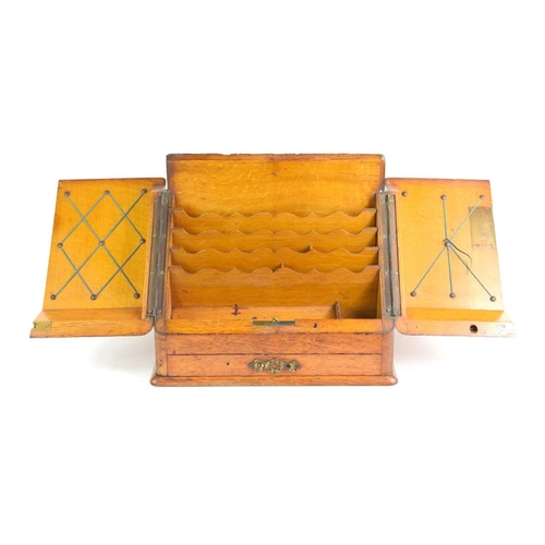 27 - An early 20th century two door oak stationery box, fitted interior and single drawer below, 26.5cm h... 