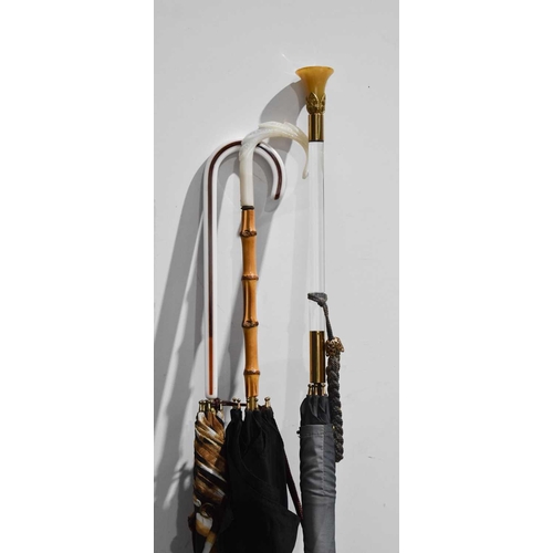 276 - Three vintage umbrellas, circa 1970, with perspex handles of differing style and form. (3)