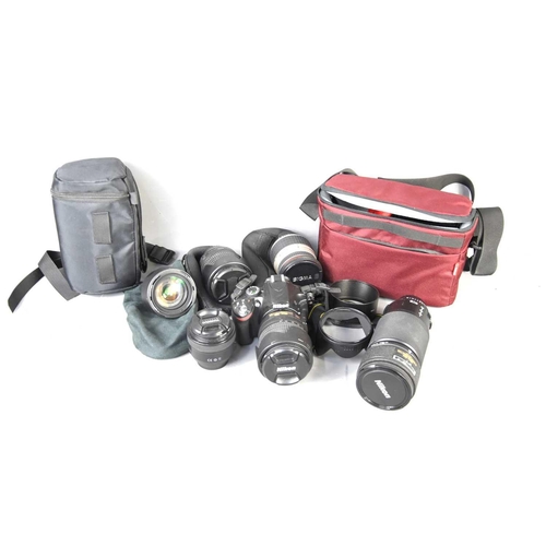 306 - A Nikon D3200 SLR digital camera with various lenses to include Sigma 28-300mm, Nikon 18-70mm, Nikon... 